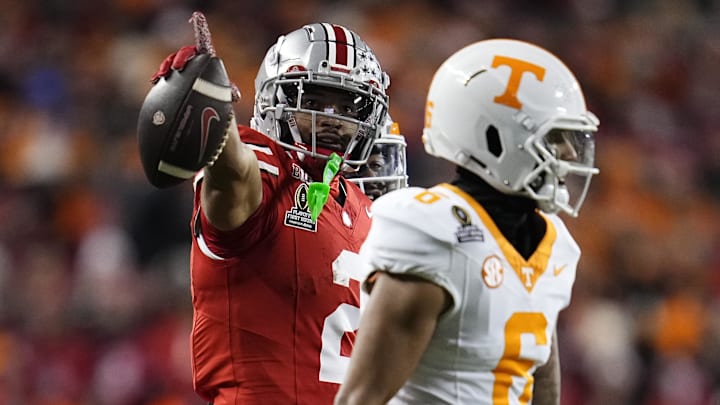 Ohio State Buckeyes WR Emeka Egbuka celebrates after a first-down catch behind Tennessee Volunteers DB Jalen McMurray. 