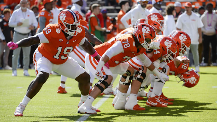 Oct 19, 2024; Clemson, South Carolina, USA; Clemson Tigers offensive lineman Blake Miller (78) and teammates warm up prior to the game against the Virginia Cavaliers at Memorial Stadium. Mandatory Credit: Alexander Hicks-Imagn Images