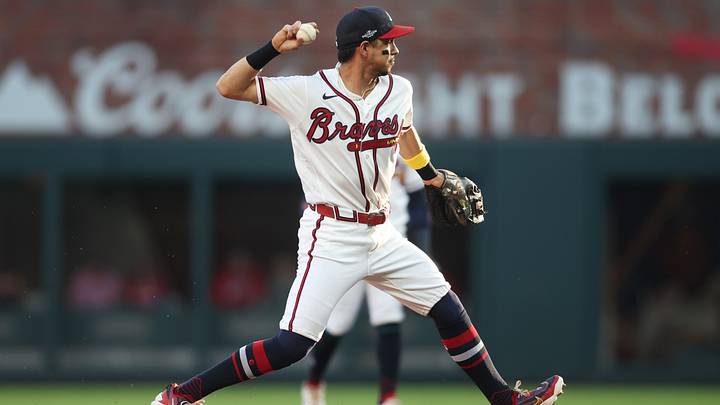 Oct 7, 2026; Cumberland, Georgia, USA; Atlanta Braves outfielder Mauricio Dubon (14) throws to first for an out against the Los Angeles Dodgers during the first inning in game four of the NLDS for the 2026 MLB Playoffs at Truist Park. Mandatory Credit: Brett Davis-Imagn Images Oct 7, 2026; Cumberland, Georgia, USA; Atlanta Braves outfielder Mauricio Dubon (14) throws to first for an out against the Los Angeles Dodgers during the first inning in game four of the NLDS for the 2026 MLB Playoffs at Truist Park. Mandatory Credit: Brett Davis-Imagn Images