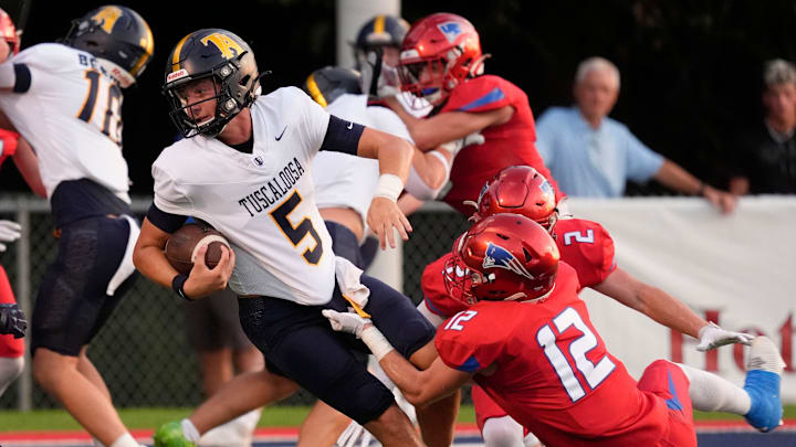 Tuscaloosa Academy's Mark Norris (5) is tackled by ACA's Parker Graves (12) and ACA’s Will Durrett (2) at American Christian Academy Aug. 21 to open the 2025 high school football season in Alabama.