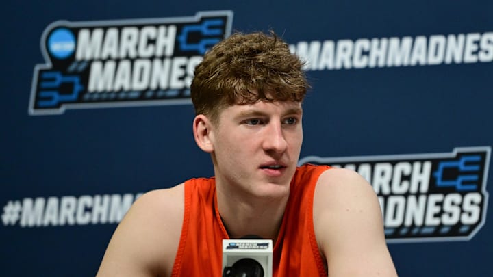 Mar 20, 2025; Milwaukee, WI, USA;  Illinois Fighting Illini guard Kasparas Jakucionis (32) speaks at press conference during NCAA Tournament First Round Practice at Fiserv Forum. Mandatory Credit: Benny Sieu-Imagn Images