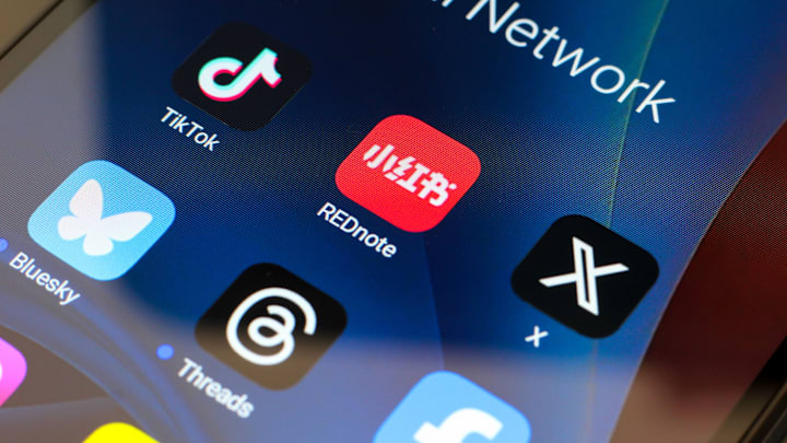 In this photo illustration, the TikTok, Xiaohongshu (Rednote...