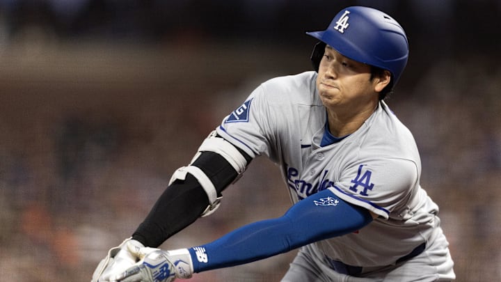 Apr 21, 2026; San Francisco, California, USA; Los Angeles Dodgers designated hitter Shohei Ohtani (17) reaches out to hit a pitch against the San Francisco Giants during the fifth inning at Oracle Park. Ohtani flew out to deep right field. Mandatory Credit: D. Ross Cameron-Imagn Images