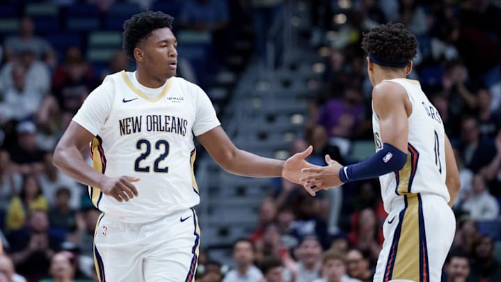 Dec 26, 2025; New Orleans, Louisiana, USA;  New Orleans Pelicans center Derik Queen (22) celebrates a basket with guard Jeremiah Fears (0) during the first half against the Phoenix Suns at Smoothie King Center. Mandatory Credit: Matthew Hinton-Imagn Images