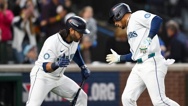 Oct 5, 2025; Seattle, Washington, USA; Seattle Mariners second baseman Jorge Polanco (7) celebrates his solo home run with third baseman Eugenio Suarez (28) in the sixth inning against the Detroit Tigers during game two of the ALDS round for the 2025 MLB playoffs at T-Mobile Park. Mandatory Credit: Steven Bisig-Imagn Images Oct 5, 2025; Seattle, Washington, USA; Seattle Mariners second baseman Jorge Polanco (7) celebrates his solo home run with third baseman Eugenio Suarez (28) in the sixth inning against the Detroit Tigers during game two of the ALDS round for the 2025 MLB playoffs at T-Mobile Park. Mandatory Credit: Steven Bisig-Imagn Images