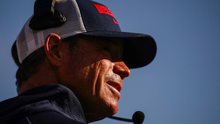 Connecticut Huskies coach Jim Mora directs the action against Temple. 