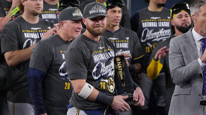 Oct 15, 2026: Milwaukee Brewers first baseman Jake Bauers (9) celebrates with the MVP trophy after defeating the Los Angeles Dodgers in game four of the NLCS for the 2026 MLB Playoffs at Uniqlo Field at Dodger Stadium. Credit: Kirby Lee-Imagn Images
