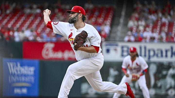 Jul 30, 2024; St. Louis, Missouri, USA;  St. Louis Cardinals starting pitcher Lance Lynn (31) pitches against the Texas Rangers during the first inning at Busch Stadium. Mandatory Credit: Jeff Curry-Imagn Images