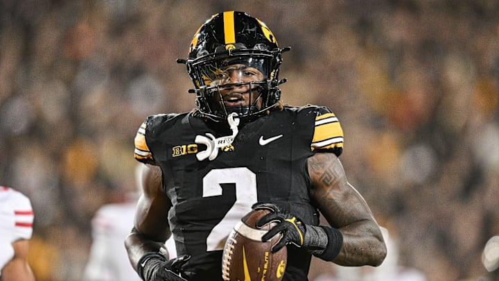 Nov 2, 2024; Iowa City, Iowa, USA;  Iowa Hawkeyes running back Kaleb Johnson (2) runs for a 16 yard touchdown against the Wisconsin Badgers during the second quarter at Kinnick Stadium. Mandatory Credit: Jeffrey Becker-Imagn Images