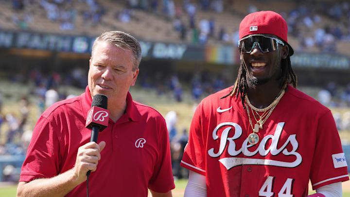 Jul 30, 2023; Los Angeles, California, USA; Bally Sports reporter Jim Day (left) interviews Cincinnati Reds shortstop Elly De La Cruz (44) after the game against the Los Angeles Dodgers at Dodger Stadium. Mandatory Credit: Kirby Lee-Imagn Images