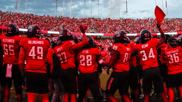 Sep 27, 2025; Raleigh, North Carolina, USA; North Carolina State Wolfpack bench celebrates before the first half of the game against Virginia Tech Hokies at Carter-Finley Stadium. Mandatory Credit: Jaylynn Nash-Imagn Images