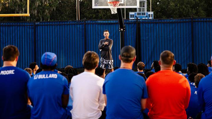 Florida men's basketball coach Todd Golden speaks to the football team during fall camp. Florida men's basketball coach Todd Golden speaks to the football team during fall camp.