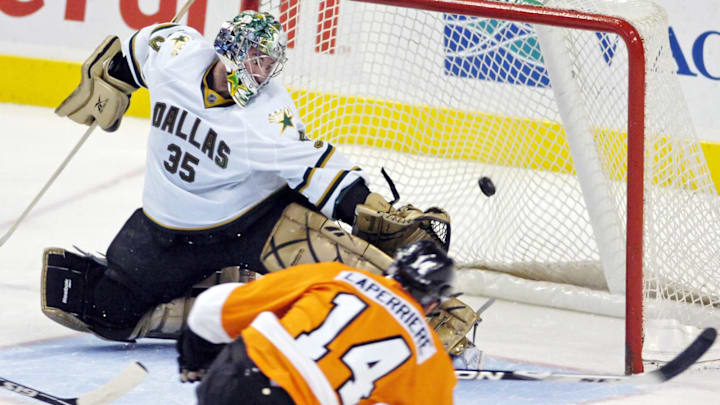 January 12, 2010; Philadelphia, PA USA;  Philadelphia Flyers right wing Ian Laperriere (14) beats Dallas Stars goalie Marty Turco (35) during 2nd period of game at the Wachovia Center in Philadelphia.