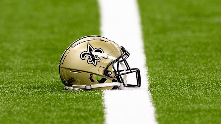 Aug 25, 2024; New Orleans, Louisiana, USA; New Orleans Saints helmet on the turf during warmups before the game against the Tennessee Titans at Caesars Superdome. Mandatory Credit: Stephen Lew-Imagn Images Aug 25, 2024; New Orleans, Louisiana, USA; New Orleans Saints helmet on the turf during warmups before the game against the Tennessee Titans at Caesars Superdome. Mandatory Credit: Stephen Lew-Imagn Images