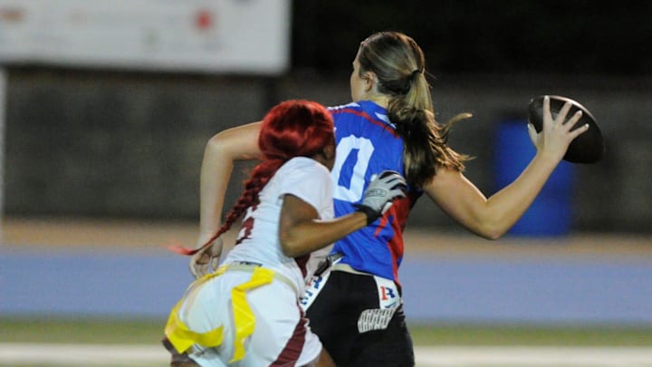 Gadsden City flag football's Kyla Price rushes the QB as the Titans took on Vestavia Hills High School in the AHSAA Class 6A-7A state flag football playoffs in Vestavia Hills, Alabama on Tuesday, Nov. 5, 2024. (Maxwell Donaldson, The Gadsden Times)