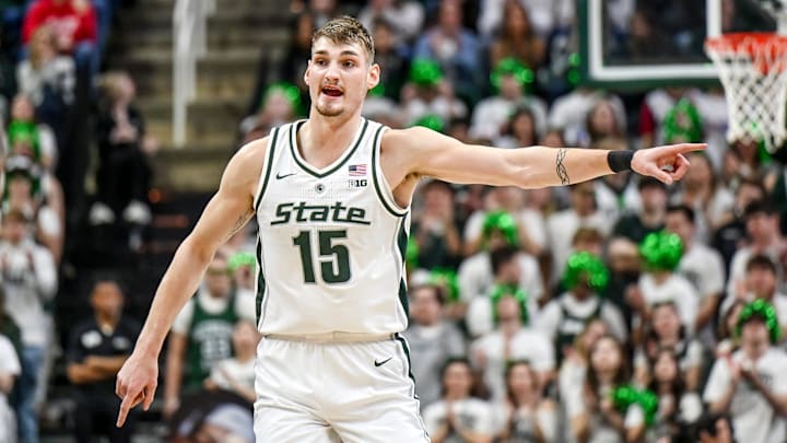 Michigan State's Carson Cooper communicates with teammates after making a shot against Ohio State during the first half on Sunday, Feb. 22, 2026, at the Breslin Center in East Lansing.