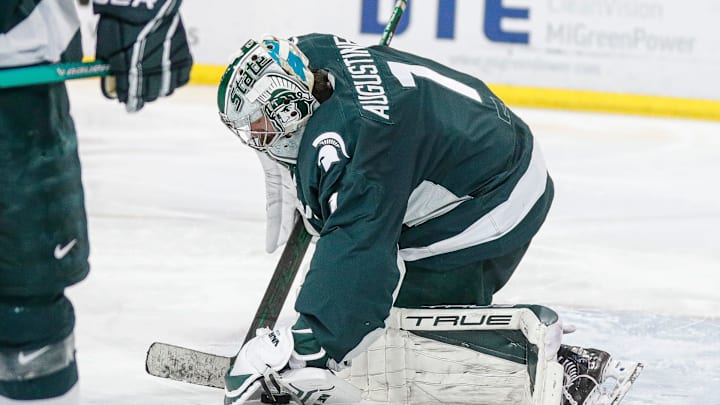 Michigan State goaltender Trey Augustine makes a save against Michigan during the third period at Yost Ice Arena in Ann Arbor on Friday, Feb. 9, 2024.