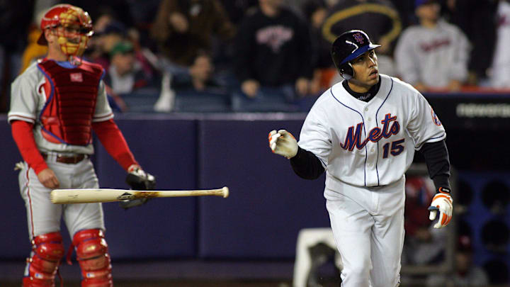 The Mets Carlos Beltran tosses his bat aside after hitting a three-run homer in the 7th inning, as Phillies catcher Mike Lieberthal looks on in Queens on May 2, 2005.

75j00kue