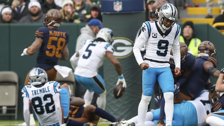 Nov 2, 2025; Green Bay, Wisconsin, USA; Carolina Panthers quarterback Bryce Young (9) reacts as running back Rico Dowdle (5) scores a touchdown against the Green Bay Packers during the game at Lambeau Field. Mandatory Credit: Tork Mason-USA TODAY Network via Imagn Images