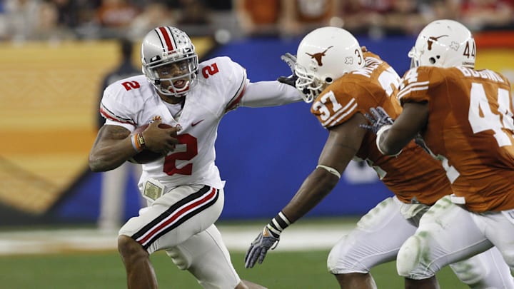 Jan 5, 2009, Glendale, AZ, USA; Ohio State quarterback Terrelle Pryor (2) runs for a first down in the first quarter as Texas defensive end Henry Melton (37) attempts to make the stop at the 2009 Fiesta Bowl at University of Phoenix Stadium. The Texas Longhorns defeated the Ohio State Buckeyes 24-21. Mandatory Credit: Leon Halip-Imagn Images