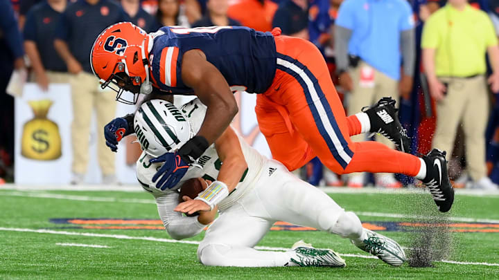 Aug 31, 2024; Syracuse, New York, USA; Syracuse Orange defensive lineman Fadil Diggs (10) sacks Ohio Bobcats quarterback Parker Navarro (13) during the second half at the JMA Wireless Dome. Mandatory Credit: Rich Barnes-Imagn Images Aug 31, 2024; Syracuse, New York, USA; Syracuse Orange defensive lineman Fadil Diggs (10) sacks Ohio Bobcats quarterback Parker Navarro (13) during the second half at the JMA Wireless Dome. Mandatory Credit: Rich Barnes-Imagn Images