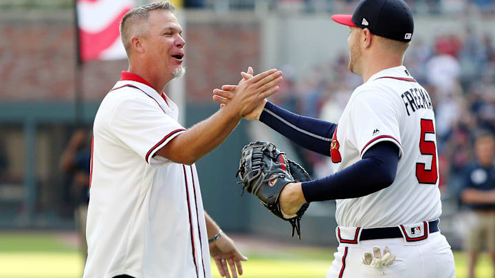 Former Atlanta Braves player Chipper Jones shakes hands with Atlanta Braves first baseman Freddie Freeman Former Atlanta Braves player Chipper Jones shakes hands with Atlanta Braves first baseman Freddie Freeman