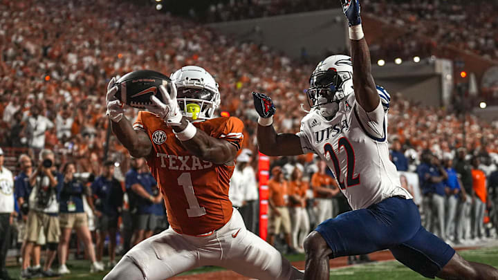 Texas receiver Johntay Cook makes a touchdown catch over UTSA safety Elijah Newell this season. 