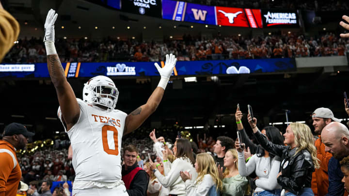 Texas Longhorns tight end Ja'Tavion Sanders (0) hypes up the crowd as he takes the field ahead of the Sugar Bowl College Football Playoff semifinals game against the Washington Huskies at the Caesars Superdome on Monday, Jan. 1, 2024 in New Orleans, Louisiana. Texas Longhorns tight end Ja'Tavion Sanders (0) hypes up the crowd as he takes the field ahead of the Sugar Bowl College Football Playoff semifinals game against the Washington Huskies at the Caesars Superdome on Monday, Jan. 1, 2024 in New Orleans, Louisiana.