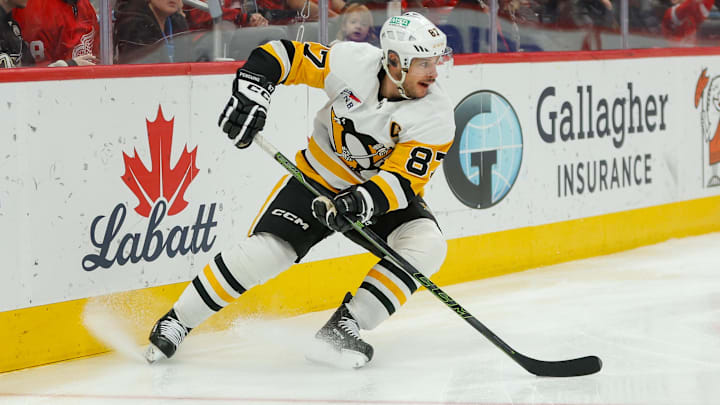Jan 3, 2026; Detroit, Michigan, USA; Pittsburgh Penguins center Sidney Crosby (87) handles the puck during the third period against the Detroit Red Wings at Little Caesars Arena. Mandatory Credit: Brian Bradshaw Sevald-Imagn Images