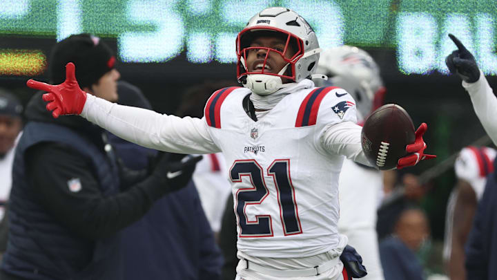 Dec 28, 2025; East Rutherford, New Jersey, USA; New England Patriots safety Jaylinn Hawkins (21) celebrates an interception against the New York Jets during the first quarter of the game at MetLife Stadium. Mandatory Credit: Vincent Carchietta-Imagn Images