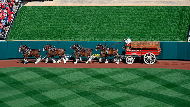The Budweiser Clydesdales circle Busch Stadium on Opening Day 2023