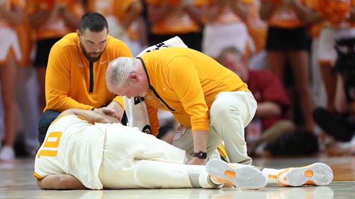 Feb 28, 2026; Knoxville, Tennessee, USA;  Tennessee Volunteers forward Nate Ament (10) is attended to after an injury during the first half against the Alabama Crimson Tide at Thompson-Boling Arena at Food City Center. Mandatory Credit: Randy Sartin-Imagn Images