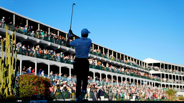 Jordan Spieth plays his tee shot on the 16th hole during round three at TPC Scottsdale on Feb. 11,