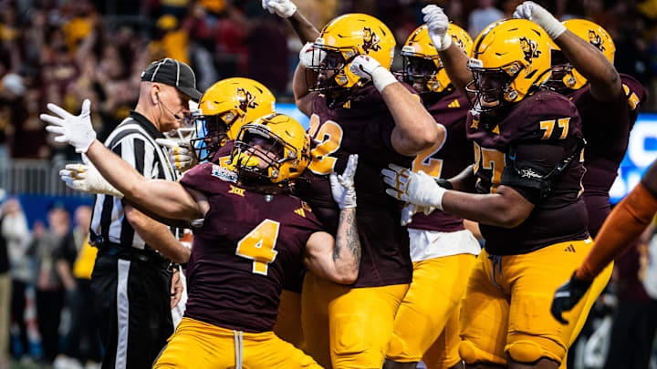 Arizona State celebrate together after Arizona State Sun Devils running back Cam Skattebo (4) scores a touchdown in the fourth quarter as the Texas Longhorns play the Arizona State Sun Devils in the Peach Bowl College Football Playoff quarterfinal at Mercedes-Benz Stadium in Atlanta, Georgia, Jan. 1, 2025. Arizona State celebrate together after Arizona State Sun Devils running back Cam Skattebo (4) scores a touchdown in the fourth quarter as the Texas Longhorns play the Arizona State Sun Devils in the Peach Bowl College Football Playoff quarterfinal at Mercedes-Benz Stadium in Atlanta, Georgia, Jan. 1, 2025.