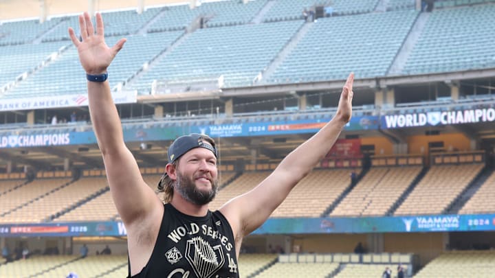 Dodgers pitcher Clayton Kershaw waves to the crowd during the 2025 World Series championship celebration at Dodger Stadium in Los Angeles on Monday, Nov. 3, 2025.