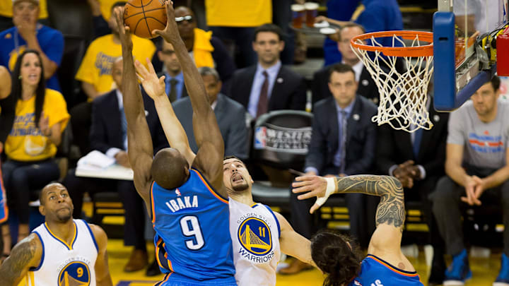 May 30, 2016; Oakland, CA, USA; Oklahoma City Thunder forward Serge Ibaka (9) controls a rebound against Golden State Warriors guard Klay Thompson (11) during the second quarter in game seven of the Western conference finals of the NBA Playoffs at Oracle Arena. Mandatory Credit: Kelley L Cox-Imagn Images