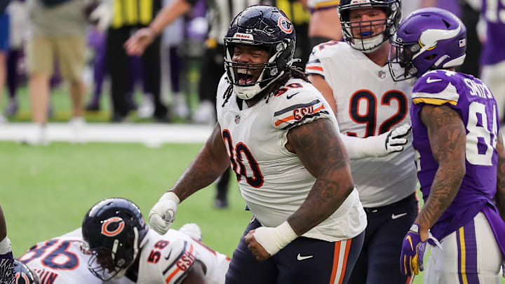 Dec 20, 2020; Minneapolis, Minnesota, USA; Chicago Bears defensive lineman John Jenkins (90) celebrates a tackle in the second quarter against the Minnesota Vikings at U.S. Bank Stadium. Mandatory Credit: Brad Rempel-Imagn Images