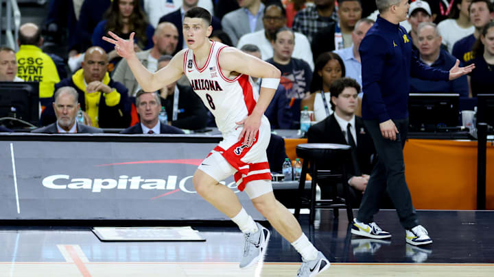 Apr 4, 2026; Indianapolis, IN, USA; Arizona Wildcats forward Ivan Kharchenkov (8) celebrates after making a three-point basket against the Michigan Wolverines in the first half during a semifinal of the Final Four of the men's 2026 NCAA Tournament at Lucas Oil Stadium. Mandatory Credit: Trevor Ruszkowski-Imagn Images