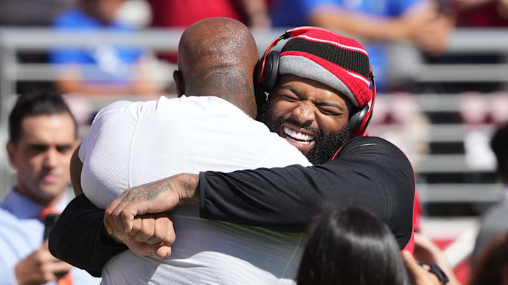 Sep 9, 2024; Santa Clara, California, USA; San Francisco 49ers offensive tackle Trent Williams (right) greets New York Jets offensive tackle Morgan Moses (left) before the game at Levi's Stadium. Mandatory Credit: Darren Yamashita-Imagn Images