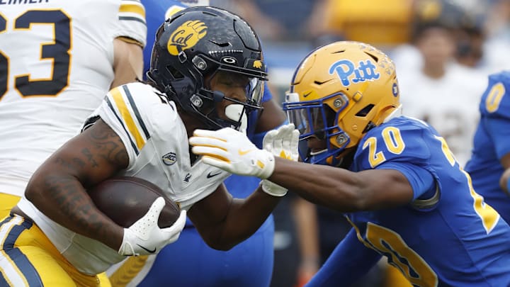 Oct 12, 2024; Pittsburgh, Pennsylvania, USA;  California Golden Bears running back Kadarius Calloway (2) runs the ball against Pittsburgh Panthers linebacker Jordan Bass (20) during the second quarter at Acrisure Stadium. Mandatory Credit: Charles LeClaire-Imagn Images