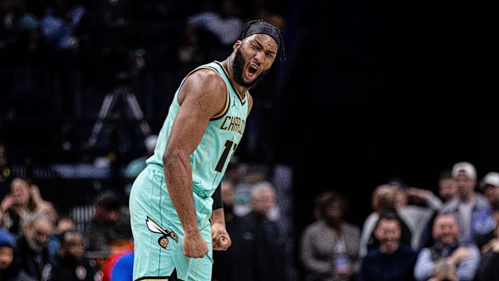 Jan 24, 2025; Charlotte, North Carolina, USA; Charlotte Hornets forward Josh Okogie (12) celebrates during the second quarter against the Portland Trail Blazers at Spectrum Center. Mandatory Credit: Scott Kinser-Imagn Images