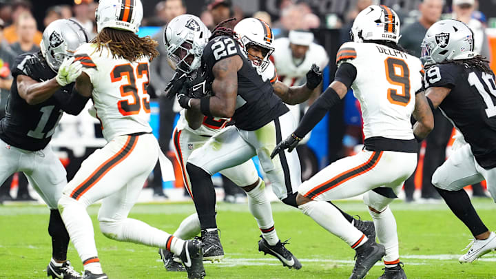 Sep 29, 2024; Paradise, Nevada, USA; Las Vegas Raiders running back Alexander Mattison (22) rushes against the Cleveland Browns during the fourth quarter at Allegiant Stadium. Mandatory Credit: Stephen R. Sylvanie-Imagn Images