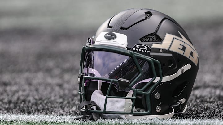 Dec 7, 2025; East Rutherford, New Jersey, USA; A general view of a Gotham City football rivalries helmet resting on the field before the game against the Miami Dolphins at MetLife Stadium. Mandatory Credit: Vincent Carchietta-Imagn Images