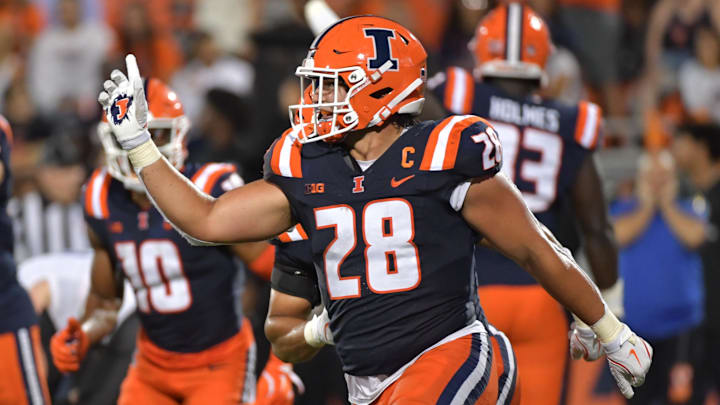 Aug 29, 2024; Champaign, Illinois, USA; Illinois Fighting Illini linebacker Dylan Rosiek (28) reacts to a fumble recovery during the second half against the Easter Illinois Panthers at Memorial Stadium. Mandatory Credit: Ron Johnson-Imagn Images Aug 29, 2024; Champaign, Illinois, USA; Illinois Fighting Illini linebacker Dylan Rosiek (28) reacts to a fumble recovery during the second half against the Easter Illinois Panthers at Memorial Stadium. Mandatory Credit: Ron Johnson-Imagn Images