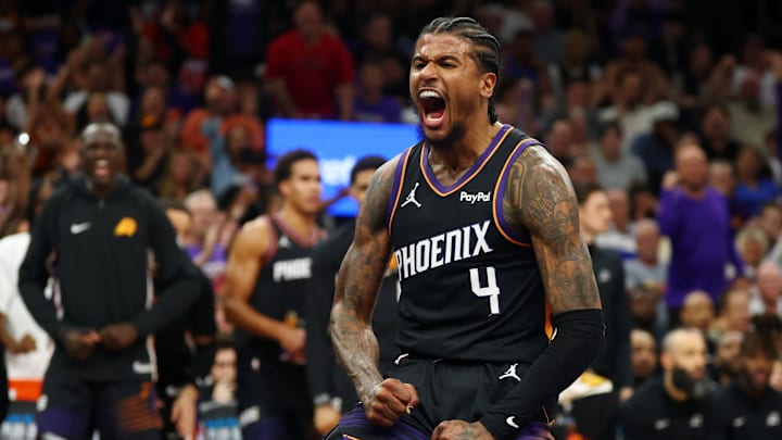 Apr 17, 2026; Phoenix, Arizona, USA; Phoenix Suns guard Jalen Green (4) celebrates after a slam dunk against the Golden State Warriors during the first half in the play-in rounds of the 2026 NBA Playoffs at Mortgage Matchup Center. Mandatory Credit: Mark J. Rebilas-Imagn Images