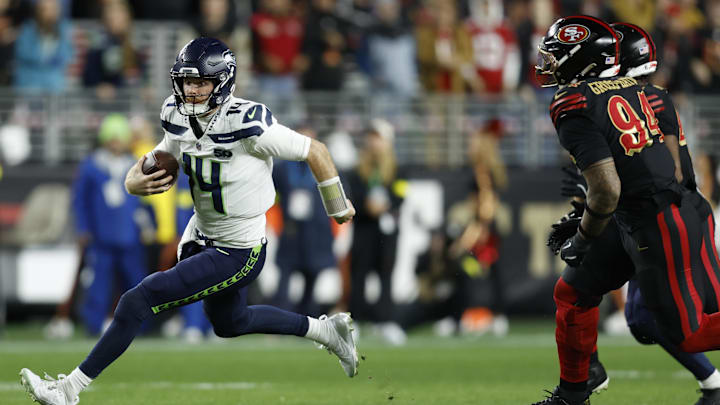 Jan 3, 2026; Santa Clara, California, USA; Seattle Seahawks quarterback Sam Darnold (14) rushes the ball against the San Francisco 49ers during the first half at Levi's Stadium. Mandatory Credit: Sergio Estrada-Imagn Images