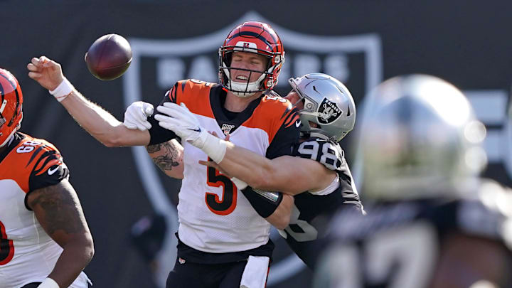 Nov 17, 2019; Oakland, CA, USA; Oakland Raiders defensive end Maxx Crosby (98) forces a fumble by Cincinnati Bengals quarterback Ryan Finley (5) during the first quarter at Oakland Coliseum. Mandatory Credit: Darren Yamashita-Imagn Images