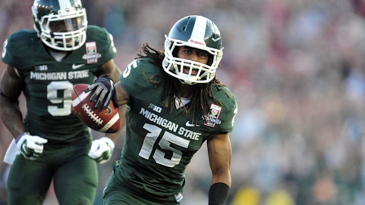 January 1, 2014; Pasadena, CA, USA; Michigan State Spartans cornerback Trae Waynes (15) celebrates after he intercepts a pass against the Stanford Cardinal during the second half at Rose Bowl. Mandatory Credit: Gary A. Vasquez-Imagn Images
