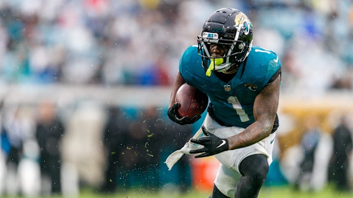 Dec 29, 2024; Jacksonville, Florida, USA; Jacksonville Jaguars running back Travis Etienne Jr. (1) runs the ball against the Tennessee Titans during the second quarter at EverBank Stadium. Mandatory Credit: Morgan Tencza-Imagn Images Dec 29, 2024; Jacksonville, Florida, USA; Jacksonville Jaguars running back Travis Etienne Jr. (1) runs the ball against the Tennessee Titans during the second quarter at EverBank Stadium. Mandatory Credit: Morgan Tencza-Imagn Images