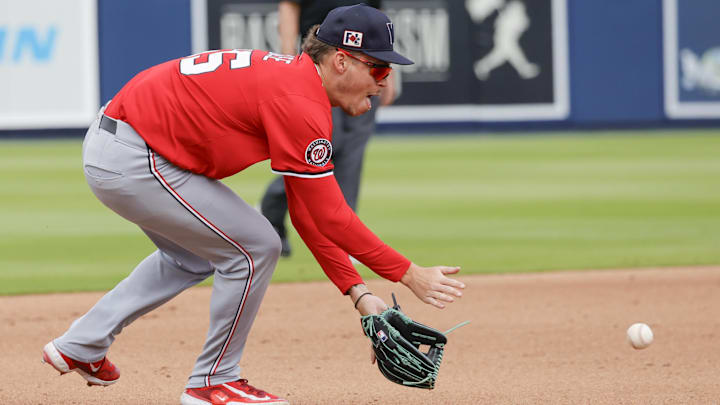 Feb 22, 2025; West Palm Beach, Florida, USA; Washington Nationals infielder Brady House fields a ground ball in the fourth inning against the Houston Astros at CACTI Park of the Palm Beaches.